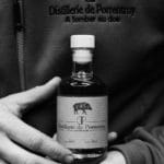 distillery porrentruy bottle hands boar
